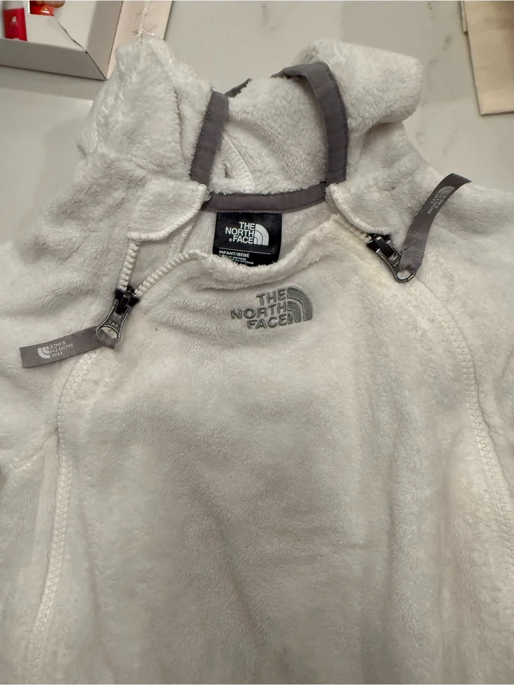 The North Face White Fleece Baby One-Piece with Gray Trim